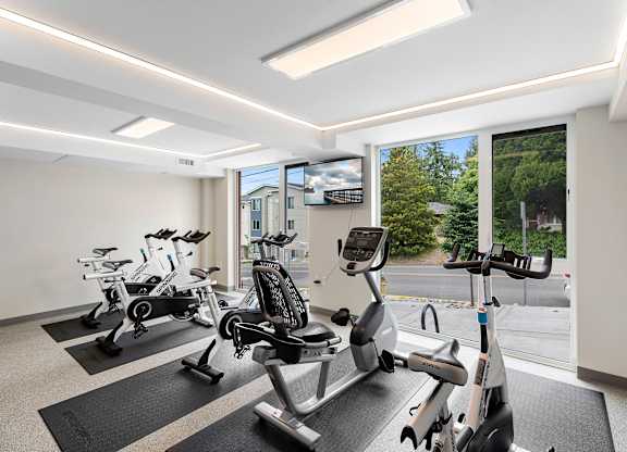 Resident Fitness Facilities filled with exercise equipment at Arabella Apartment Homes, Shoreline, 98155