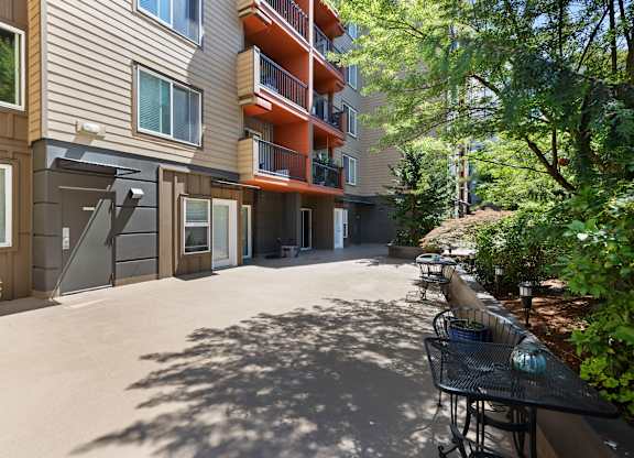 Outdoor Area with views of unit balconies at Illumina Apartment Homes, Washington