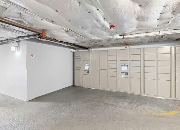 a large room with package receiving lockers  at King Arthurs Court, Seattle, 98125