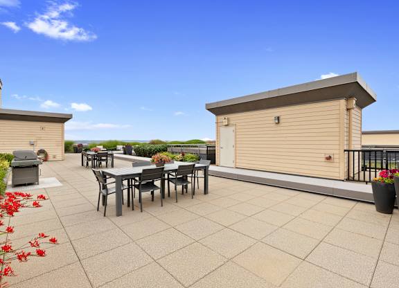 the roof terrace with resident seating areas to enjoy views at Villaggio Apartment Homes, Washington