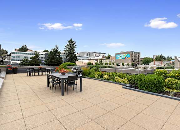 Resident Lounge on the Rooftop with a dining table and chairs at Villaggio Apartment Homes, Tacoma