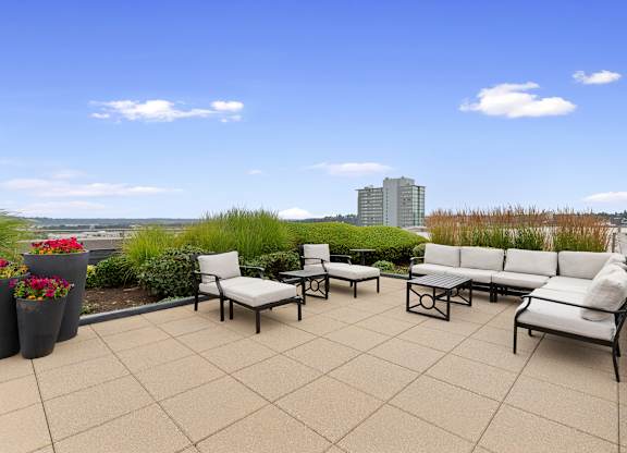 Cozy Seating Area on Rooftop Resident Lounge a view of the city at Villaggio Apartment Homes, Tacoma