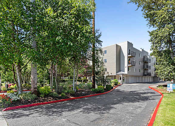 View from afar of property  building from the street at West Mall Place Apartment Homes, Washington, 98208