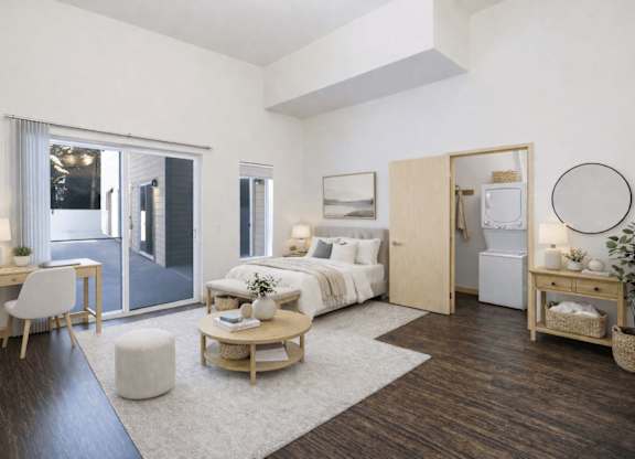 A modern bedroom with a white bed and a wooden floor.
