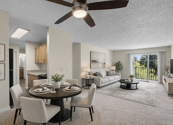 A modern dining room with a round table and chairs.