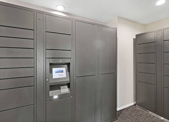 a row of package receiving lockers in the resident package room at Pinewood Square Apartment Homes, Lynnwood