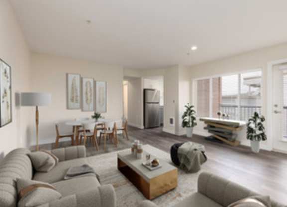 a living room with a couch and a table at Illumina Apartment Homes, Washington, 98102