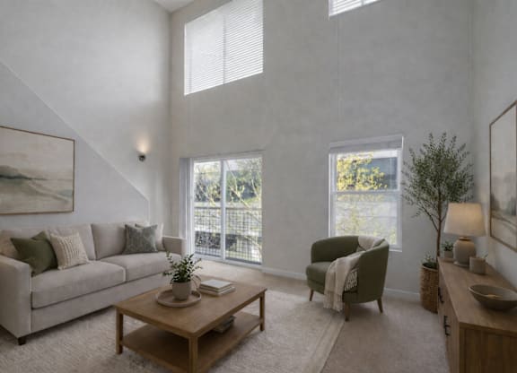 A living room with a couch, chair, and a coffee table.