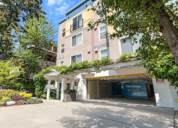 a large apartment building with a parking lot in front of it at Sir Gallahad Apartment Homes,  Bellevue, 98004