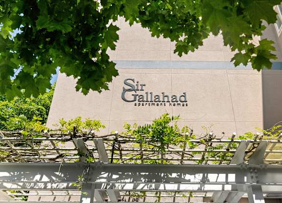 a sign on the side of a building at Sir Gallahad Apartment Homes, WA 98004