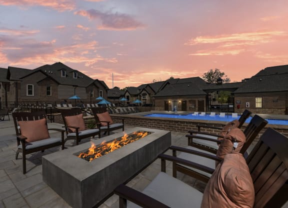 a backyard patio with a fire pit and lounge chairs  at Griffin Weston, North Carolina, 27513
