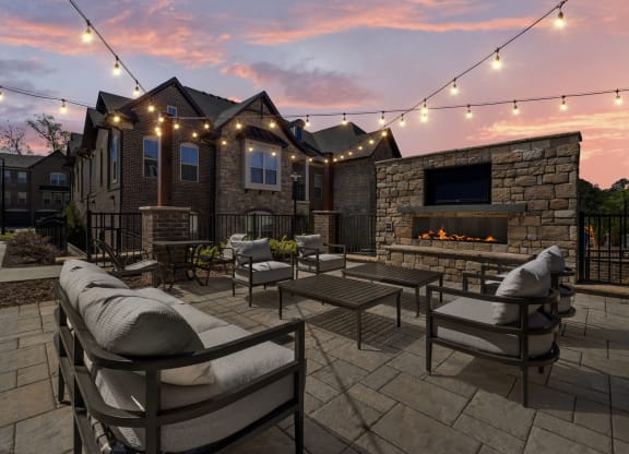 patio with fireplace and seating area at Griffin Weston, North Carolina, 27513