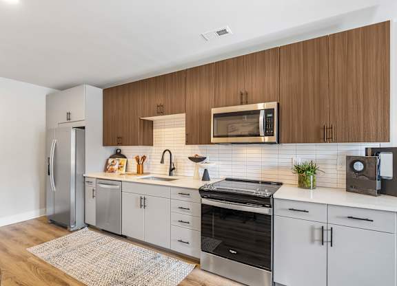 Kitchen with custom cabinets and stainless steel appliances