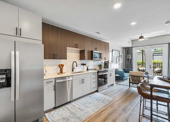 Kitchen with stainless steel refrigerator