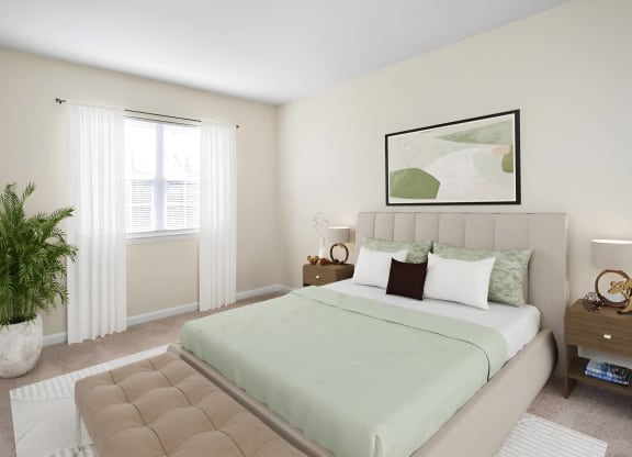 a bedroom with a bed and a window at West Pointe Apartments in Burlington, NC