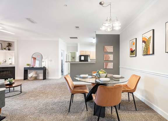 A dining room with a table set for four. at Stone Gate Apartments, Spring Lake, North Carolina