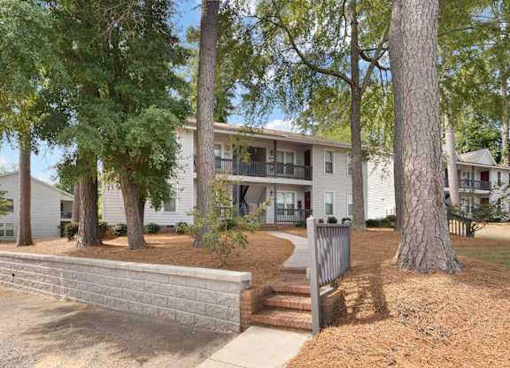 A tree in front of a building. at Hunter's Ridge Apartments, Fayetteville, NC, 28305