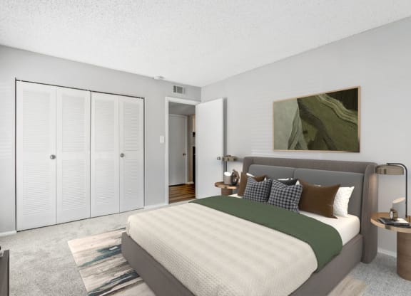 Bedroom with a Large Bed at Lakes Edge Apartments, Greensboro, NC, 27409
