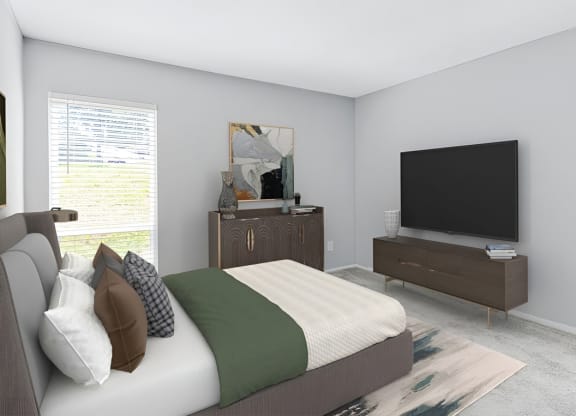 Bedroom with a bed and a television at Lakes Edge Apartments, Greensboro, North Carolina