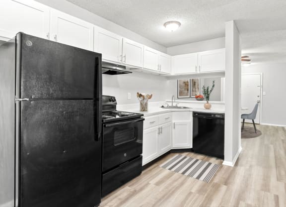 Open Kitchen with Black Appliances at Lakes Edge Apartments, Apartments, Greensboro, NC