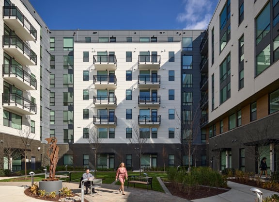 a group of buildings with people walking in front of them at Makers Rise, Virginia, 20171