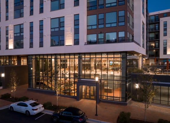 a large office building at night with cars parked in front of it at Makers Rise, Herndon, VA  