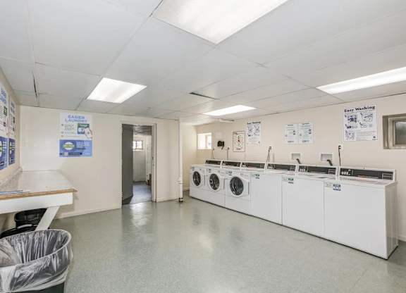 A laundry room with washers and dryers. at Park Georgetown Apartments, Arlington