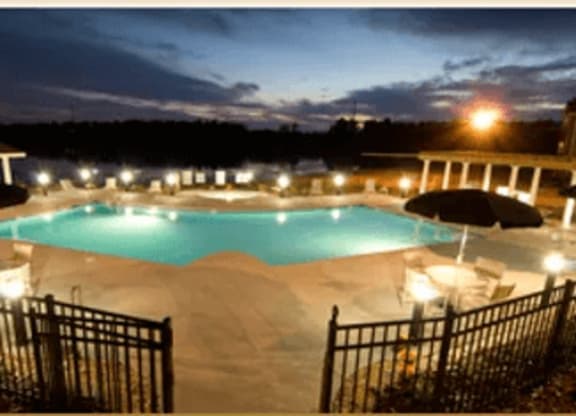 Night view of the Swimming Pool and Sundeck at Village on the Lake Apartments, Spring Lake, 28390
