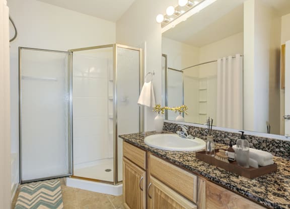 a bathroom with a sink and a shower at Stone Gate Apartments, Apartments, Spring Lake, NC