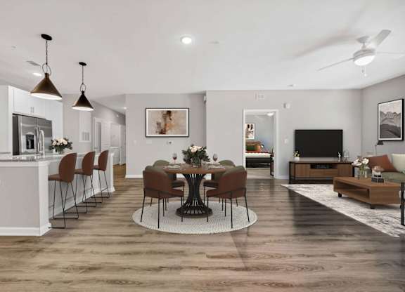 A modern kitchen with a dining table set in the middle.