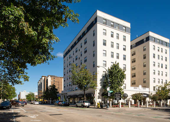 A street view of a city with cars and buildings. at Columbia Uptown Apartments, Washington