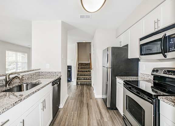 White cabinetry in kitchen at Saratoga Square, Springfield, Virginia