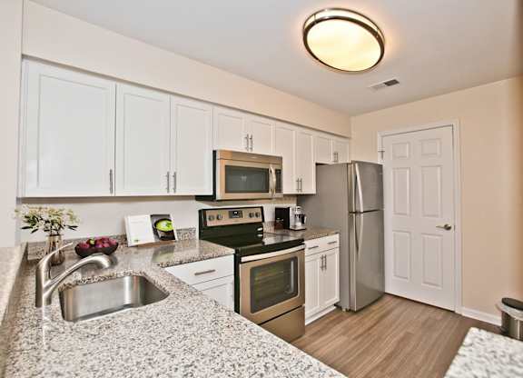 White cabinets in kitchen at Saratoga Square, Virginia, 22153
