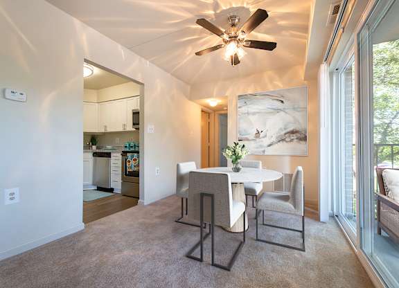 Dining room with ceiling fan at Tuscarora Creek, Leesburg, 20175