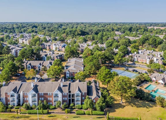 A bird's eye view of a residential area with houses and a swimming pool at The Trails at Mt. Moriah, Memphis, Tennessee