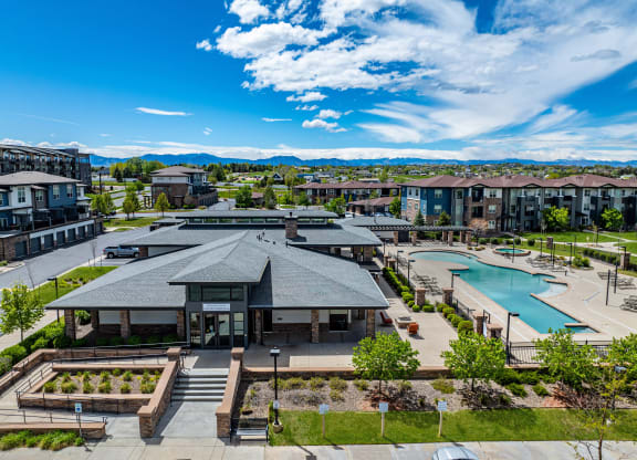 an aerial view of a community with a pool and buildings at Arbour Commons, Colorado, 80023