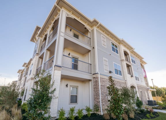 Property Building Exterior at Cue Luxury Apartments, Cypress, TX, 77433