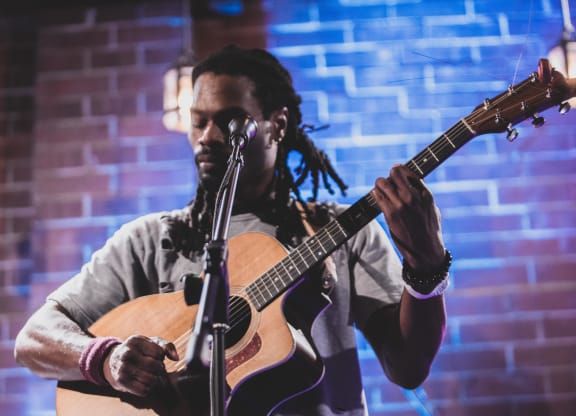 Man Playing Guitar at The Collective NoDa, North Carolina
