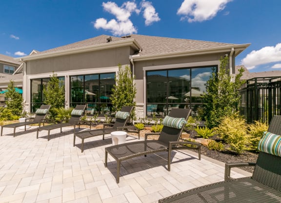 Poolside Sundeck With Relaxing Chairs at Cue Luxury Apartments, Cypress, 77433