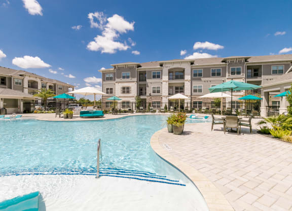 Relaxing Pool Area With Sundeck at Cue Luxury Apartments, Cypress