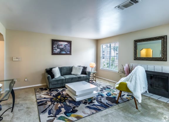 a living room with a couch and a coffee table at The Trails at Mt. Moriah, Memphis, TN 38115