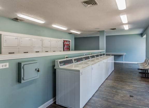 A laundry room with washers and dryers at The Trails at Mt. Moriah, Memphis, TN
