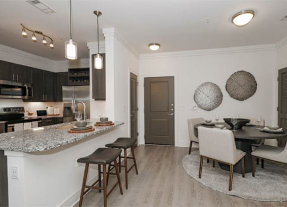 Dining And Kitchen at Cue Luxury Apartments, Cypress, Texas