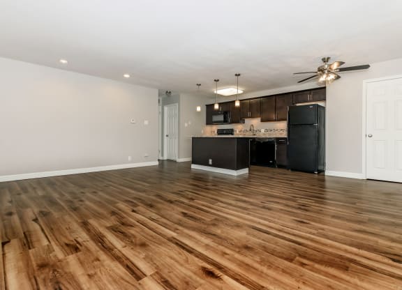 the living room and kitchen in a 555 waverly unit