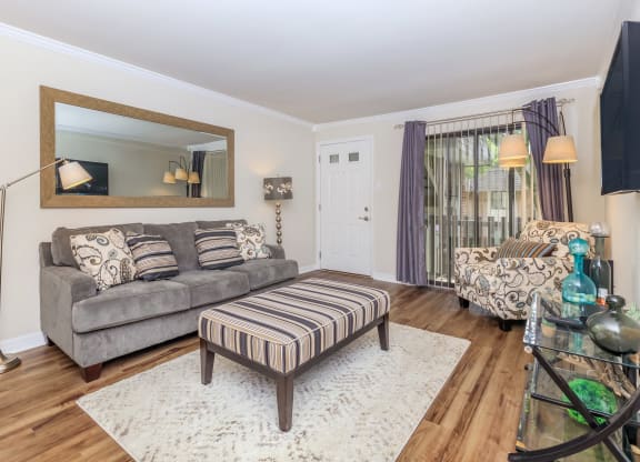 a living room with a couch and a chair