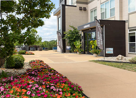 A building with clubhouse entrance  at Alinea Town and Country Luxury Apartments in Des Peres MO 63131.