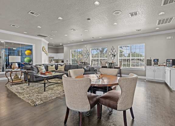A modern dining room with a table set for two.