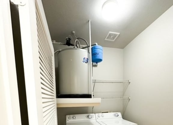 a laundry room with a washer and a dryer in it