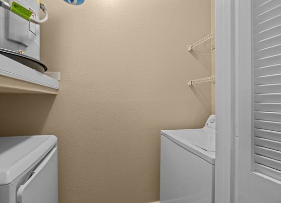 A laundry room with a washer and dryer.