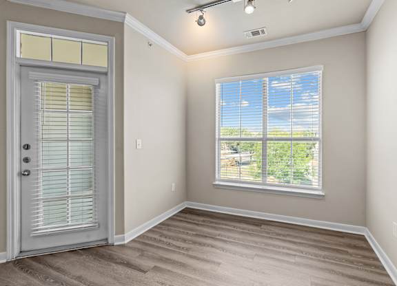A room with a door and a window.